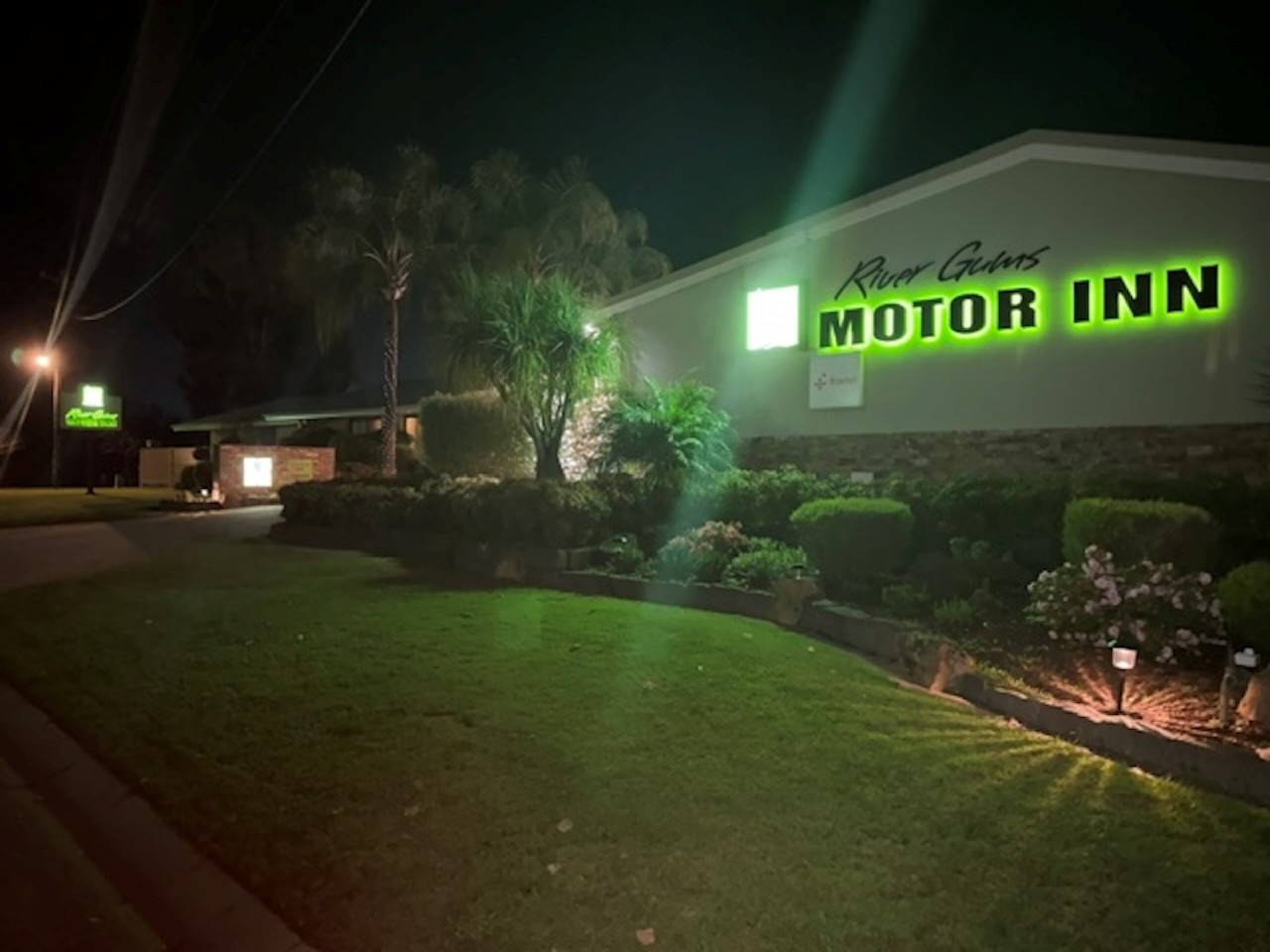 River Gums Motor Inn signage lit at night